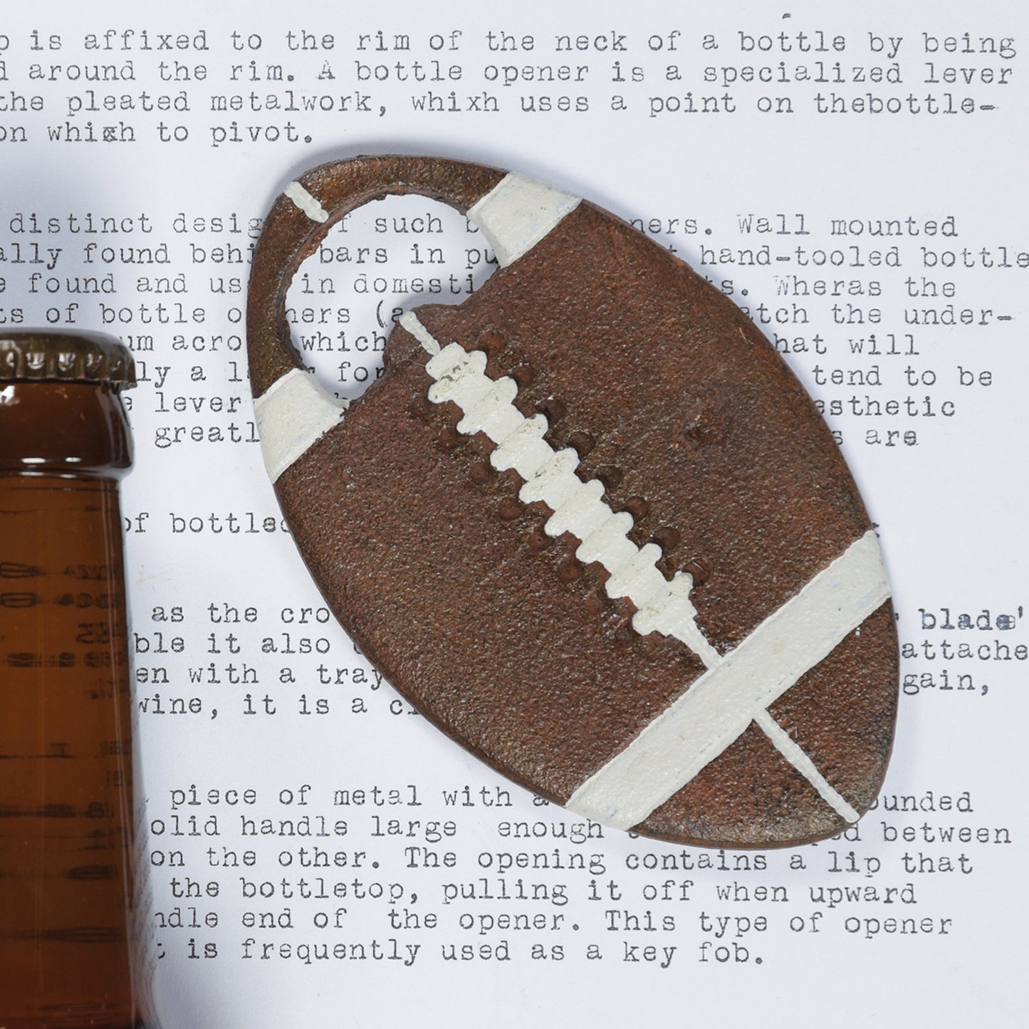 Image of a cast iron football shape beer bottle opener.
